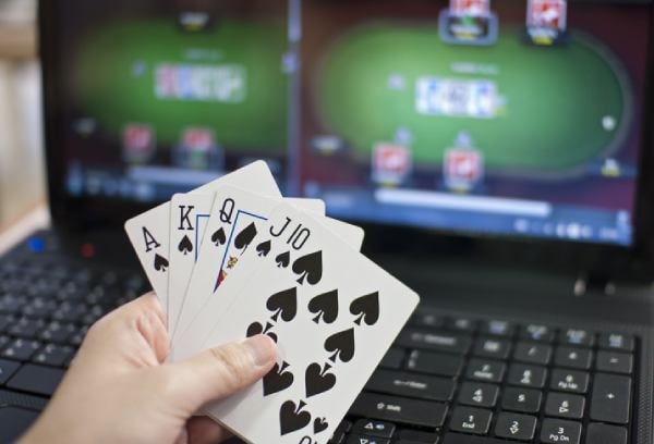 Filipino player marking bingo card on mobile browser with nutstar game